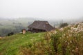 Beautiful wooden house on a green hill Royalty Free Stock Photo