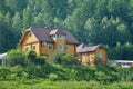 Beautiful wooden house near the forest, ecological home Royalty Free Stock Photo