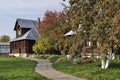 Beautiful wooden house with rowan-trees in autumn Royalty Free Stock Photo