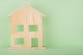 Wooden House, stick figure isolated on green background, Copy Space Royalty Free Stock Photo