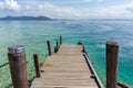 Beautiful wooden jetty with clear blue sky and clear blue sea water Royalty Free Stock Photo