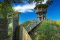 Beautiful wooden look-out tower with picnic spot on hill in rural dutch landscape along hiking and cycle trail - Heeskijk near