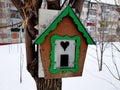 Beautiful wooden nesting box or bird feeder Royalty Free Stock Photo