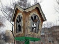 Beautiful wooden nesting box or bird feeder Royalty Free Stock Photo