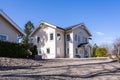 Beautiful wooden old house in beige creamy color. Two storey country house Villa cottage residence with a large windows. Royalty Free Stock Photo