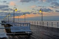 Beautiful wooden pier at sunrise Royalty Free Stock Photo