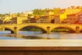 Beautiful wooden table on the background of italian florence during sunset. Copy space. Product demo template concept