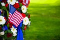 A beautiful wreath of flowers and a flag on Memorial Day Royalty Free Stock Photo