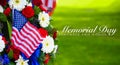 A beautiful wreath of flowers and a flag on Memorial Day Royalty Free Stock Photo