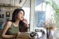 Beautiful writer looking out window, Royalty Free Stock Photo