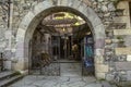 Beautiful wrought iron gate with stone arch at the entrance to the bakery on Sharambeyan street in Tufenkian Museum Old Dilijan