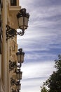 Beautiful wrought iron street lamps. Old house on the street of the Spanish city of Ronda. Early morning Royalty Free Stock Photo