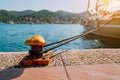 Beautiful yacht tied on the pier. Summertime feeling sunbeams, morning sunlight. Vacation on greek islands