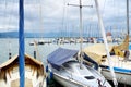 Beautiful yachts in a harbor of Lindau, a town on the coast of Bodensee lake, in Germany, on cloudy autumn day