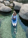 Beautiful yang lady relaxes on the paddle board