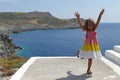 Beautiful 4 year old girl dancing with the beautiful sea background