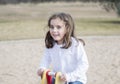 Beautiful 5-year Old Girl Playing Outside on a Playground Royalty Free Stock Photo