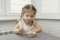 Child eats ice cream with a spoon