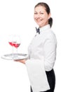 a beautiful 30-year-old waitress with glasses of red wine Royalty Free Stock Photo