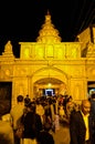 Beautiful yellow durga puja pandal and luxuries lighting in the dark. The entry gate of durga puja pandal.