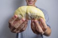 The Beautiful yellow durian, ready to eat in the hands of Asian men who like to eat a lot of durians. Thais like to eat durian tha