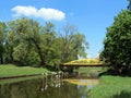 Old yellow metallic bridge by river Sysa, Lithuania Royalty Free Stock Photo