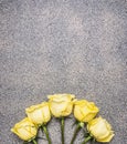 Beautiful yellow rose bouquet in rustic granite background, top view place for text Royalty Free Stock Photo