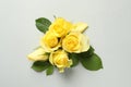 Beautiful yellow roses on light grey background, flat lay Royalty Free Stock Photo