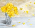 Beautiful yellow roses in a stone vase with blowing petals