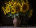 beautiful yellow Sunflower still life bouquet in a clay jug ceramic rustic style oil honey Dark photo background wooden table