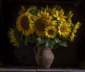 beautiful yellow Sunflower still life bouquet in a clay jug ceramic rustic style oil honey Dark photo background wooden table Royalty Free Stock Photo