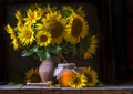 beautiful yellow Sunflower still life bouquet in a clay jug ceramic rustic style oil honey Dark photo background wooden table Royalty Free Stock Photo