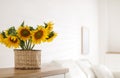Beautiful yellow sunflowers on wooden table in room, space for text Royalty Free Stock Photo