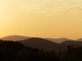 A beautiful yellow sunset on an astonishing mountain.