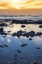 Beautiful yellow sunset and soft waves at beal beach