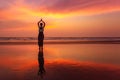 Beautiful yoga meditation reflection on water Goa beach on sunset Royalty Free Stock Photo