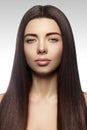 Beautiful yong woman with long straight brown hair. fashion model with smooth gloss hairstyle Royalty Free Stock Photo