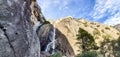 Beautiful Yosemite valley lower and upper falls through the Rocky mountains during the day time under the blue sky in California Royalty Free Stock Photo