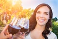 Beautiful Young Adult Woman Enjoying Glass of Wine Tasting Toast In The Vineyard with Friends Royalty Free Stock Photo