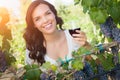 Beautiful Young Adult Woman Enjoying Glass of Wine Tasting In The Vineyard Royalty Free Stock Photo