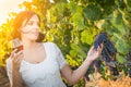 Beautiful Young Adult Woman Enjoying Glass of Wine Tasting In The Vineyard Royalty Free Stock Photo