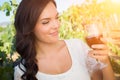Beautiful Young Adult Woman Enjoying Glass of Wine Tasting In The Vineyard Royalty Free Stock Photo