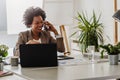 Beautiful young african american businesswoman working on computer at her office Royalty Free Stock Photo