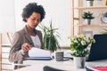 Beautiful young african american businesswoman working on computer at her office Royalty Free Stock Photo