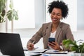 Beautiful young african american businesswoman working on computer at her office Royalty Free Stock Photo