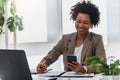 Beautiful young african american businesswoman working on computer at her office Royalty Free Stock Photo