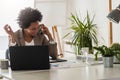 Beautiful young african american businesswoman working on computer at her office Royalty Free Stock Photo