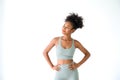Beautiful young African American girl posing with fitness clothes isolated over white background. Healthy and Fitness concept Royalty Free Stock Photo