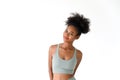 Beautiful young African American girl posing with fitness clothes isolated over white background. Healthy and Fitness concept Royalty Free Stock Photo