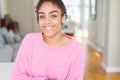 Beautiful young african american woman with afro hair with a happy and cool smile on face Royalty Free Stock Photo